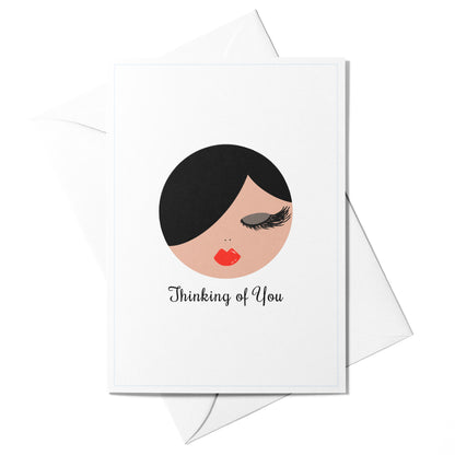 Illustrated “Thinking of You” greeting card featuring Sophie with a soft blue border